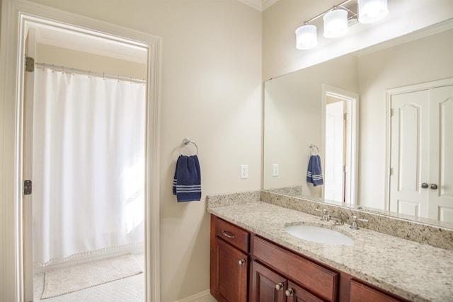 bathroom with vanity and crown molding