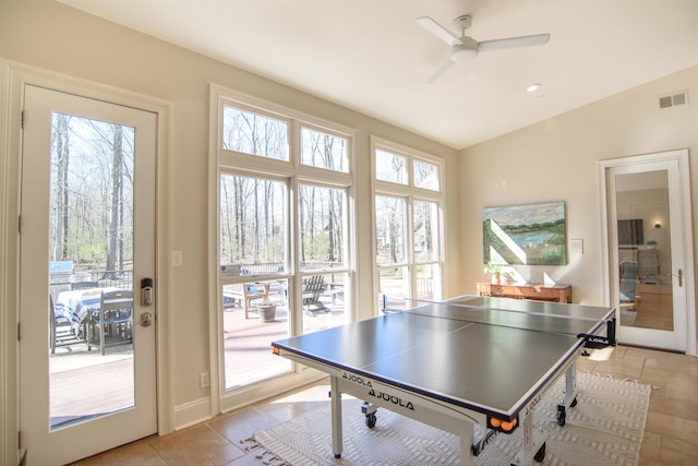 recreation room featuring light tile patterned floors, baseboards, visible vents, and a ceiling fan