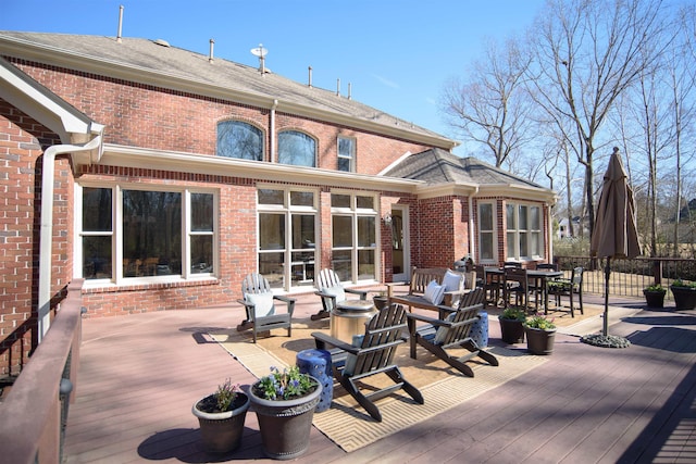 wooden deck featuring outdoor dining area