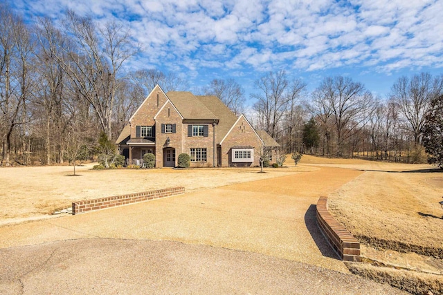 view of front of house with brick siding