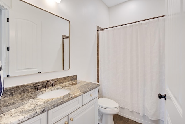 full bath with shower / tub combo with curtain, vanity, toilet, and tile patterned floors