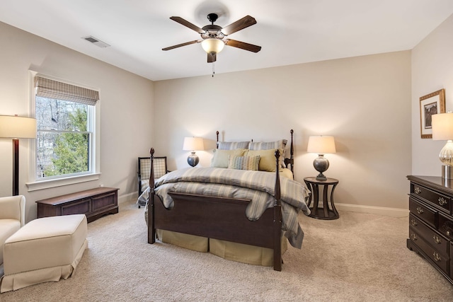 bedroom featuring ceiling fan, carpet, visible vents, and baseboards