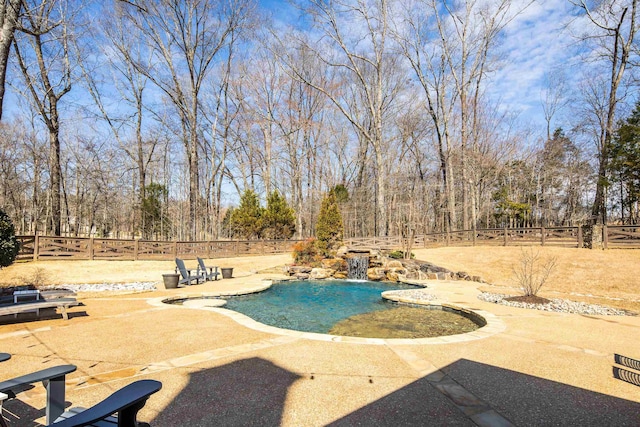 view of swimming pool featuring a fenced backyard, a fenced in pool, and a patio