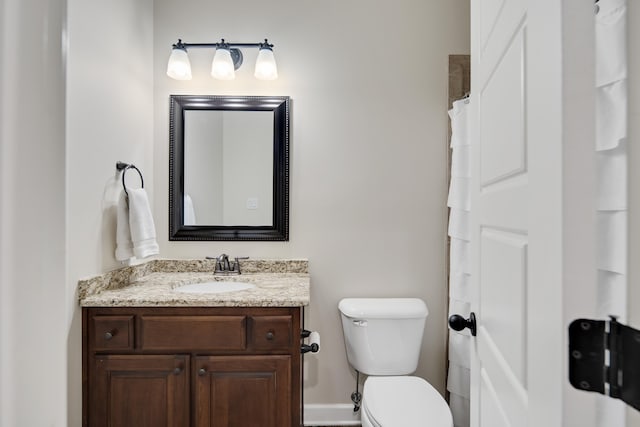 full bath with vanity and toilet