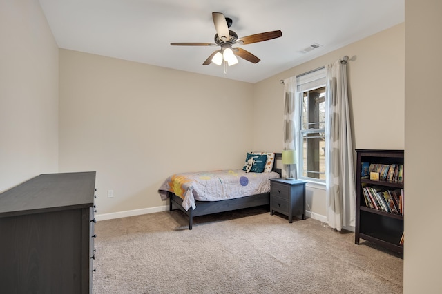 bedroom with visible vents, ceiling fan, light carpet, and baseboards