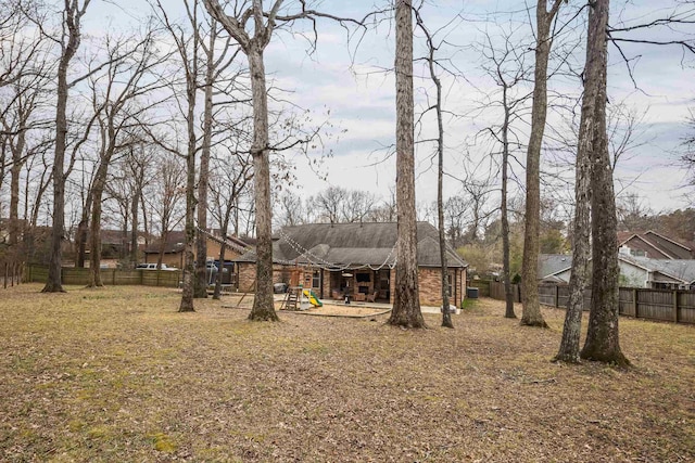 view of yard with a fenced backyard