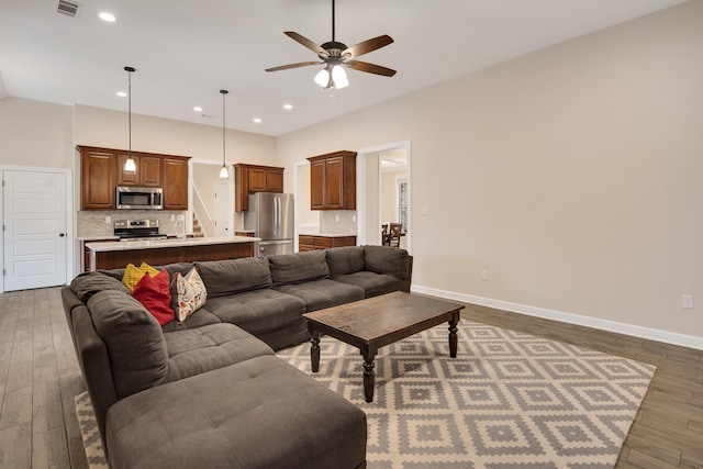 living room with recessed lighting, visible vents, ceiling fan, wood finished floors, and baseboards