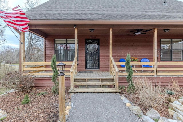 property entrance featuring covered porch and roof with shingles