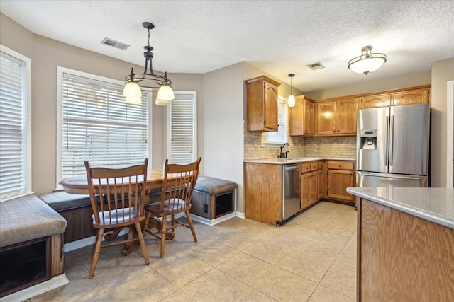 kitchen with visible vents, appliances with stainless steel finishes, and light countertops