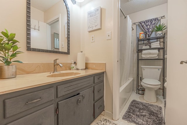 full bathroom featuring a textured ceiling, tile patterned flooring, toilet, shower / tub combo, and vanity