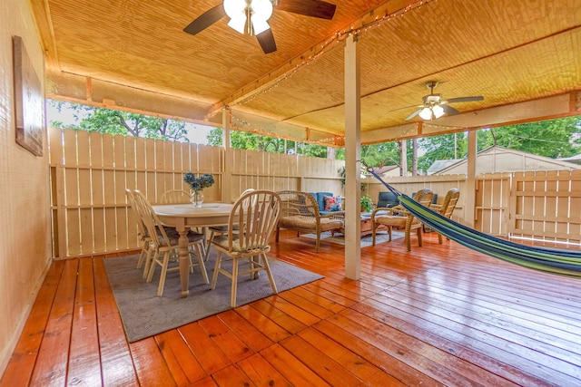 exterior space featuring ceiling fan, fence, and outdoor dining space