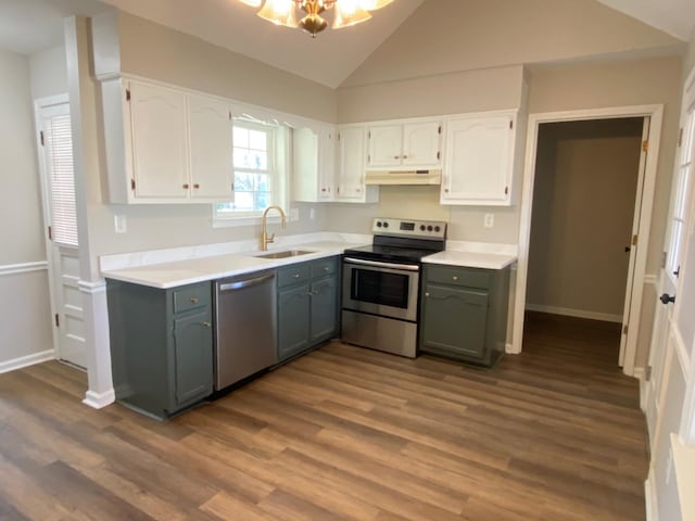 kitchen featuring appliances with stainless steel finishes, white cabinetry, a sink, and under cabinet range hood