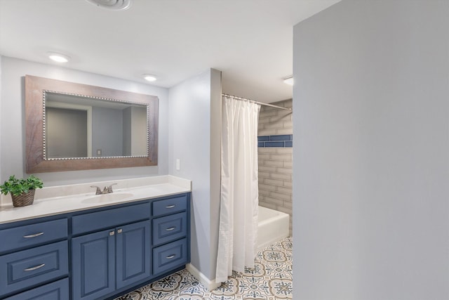 bathroom with shower / tub combo, tile patterned flooring, baseboards, and vanity