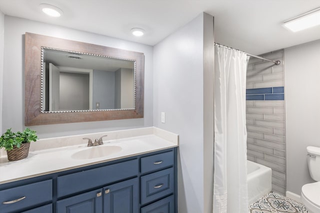 bathroom featuring shower / tub combo, tile patterned flooring, vanity, and toilet