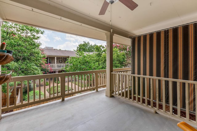 balcony with ceiling fan and covered porch