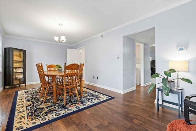 dining room with crown molding, visible vents, an inviting chandelier, wood finished floors, and baseboards