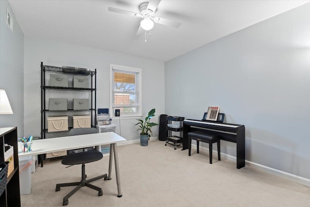 office area with a ceiling fan, carpet, visible vents, and baseboards