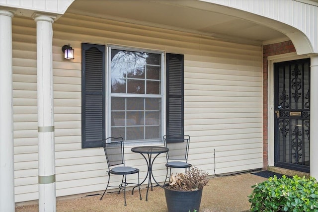 doorway to property with covered porch