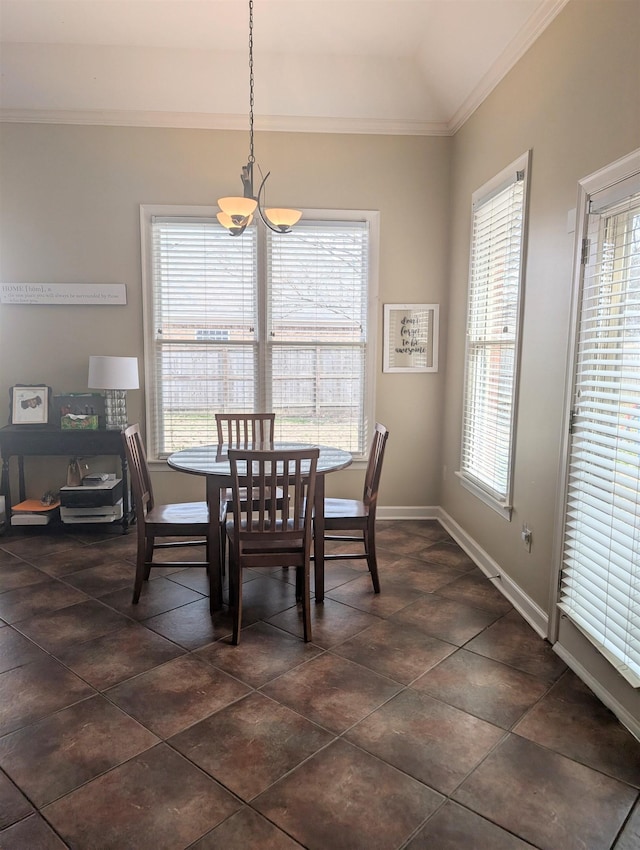 dining area with a healthy amount of sunlight and crown molding