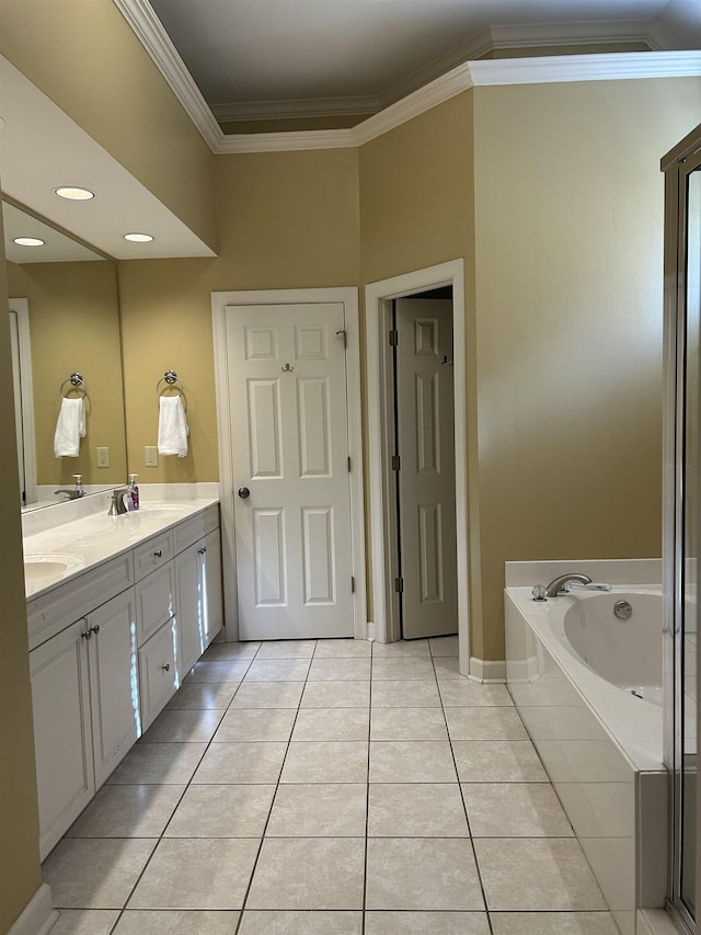 full bathroom with double vanity, tile patterned floors, a garden tub, crown molding, and a sink