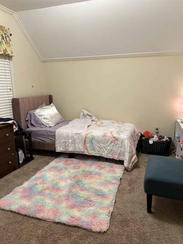 carpeted bedroom featuring vaulted ceiling and crown molding