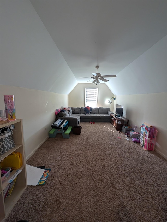 rec room with carpet, baseboards, vaulted ceiling, and a ceiling fan