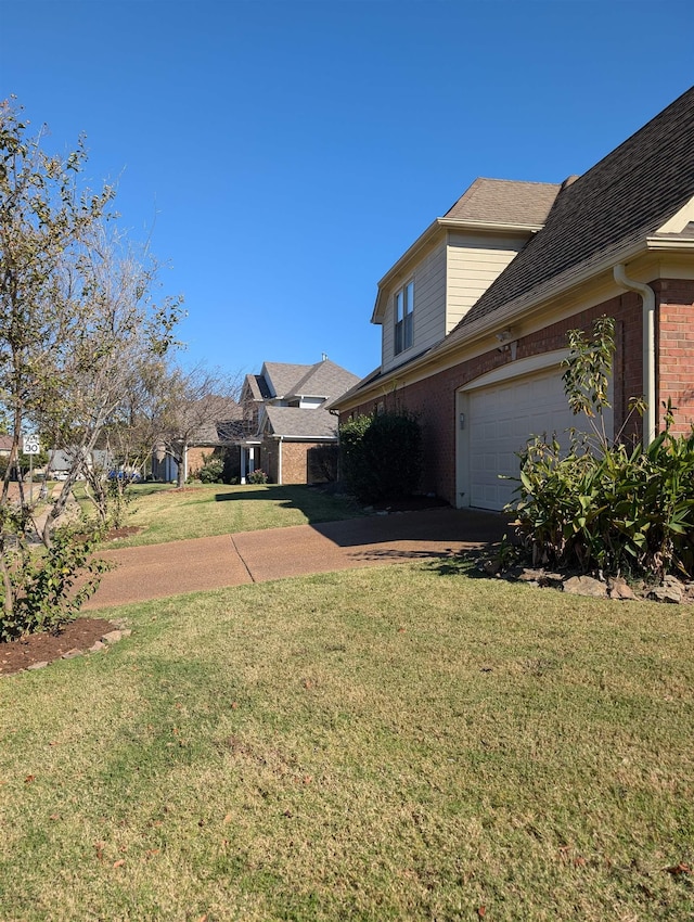 view of yard with a garage