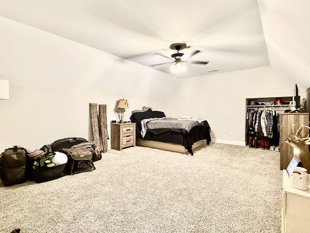 carpeted bedroom featuring vaulted ceiling, ceiling fan, a closet, and baseboards