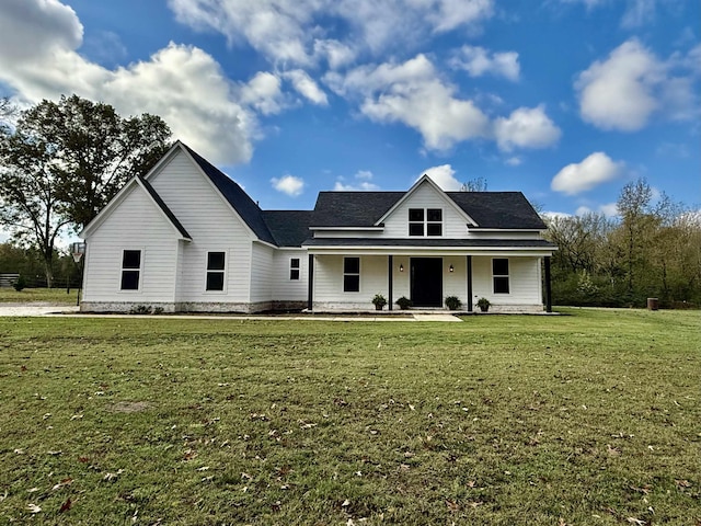 view of front of property with covered porch and a front lawn