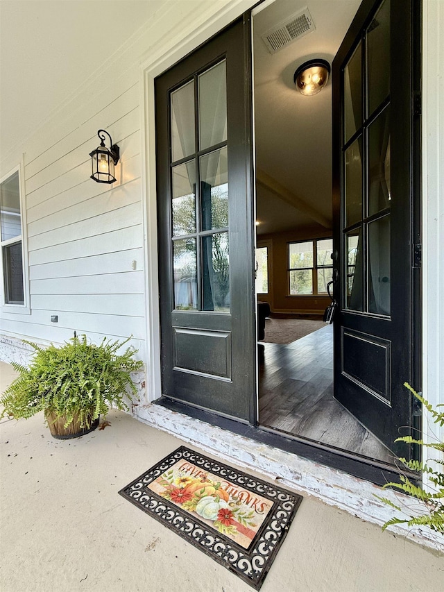 property entrance featuring visible vents