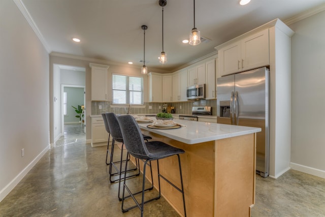 kitchen with finished concrete flooring, baseboards, stainless steel appliances, and decorative backsplash