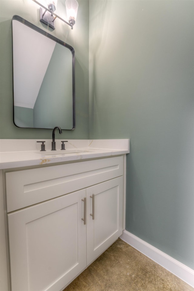 bathroom featuring vanity and baseboards