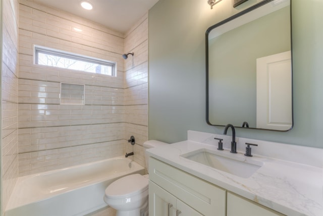 full bath featuring shower / bath combination, toilet, and vanity