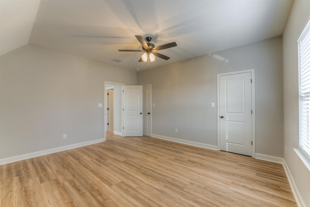 unfurnished room featuring ceiling fan, light wood-type flooring, and baseboards