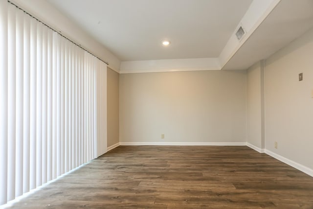 spare room featuring visible vents, baseboards, wood finished floors, and recessed lighting