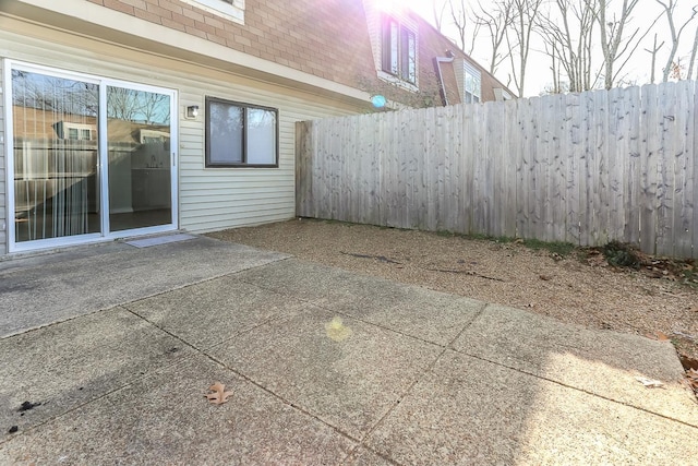 view of patio / terrace featuring fence