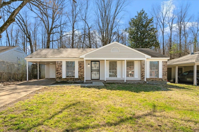 view of front of home featuring a carport, concrete driveway, brick siding, and a front lawn