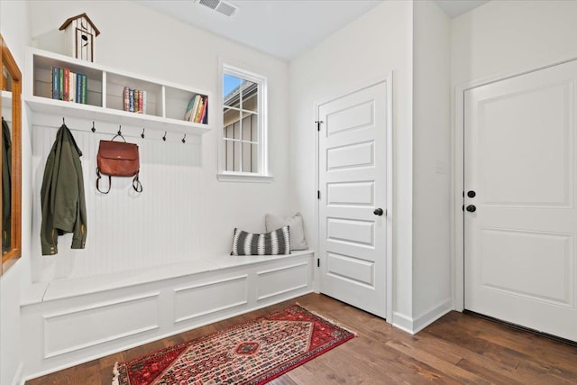 mudroom featuring dark wood-type flooring and visible vents