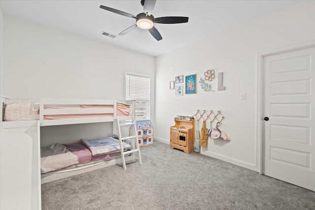 bedroom with a ceiling fan, carpet, visible vents, and baseboards