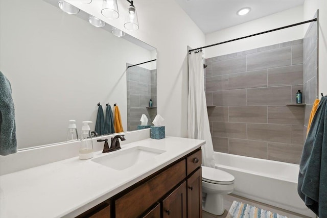 full bath with shower / bath combo, vanity, and toilet