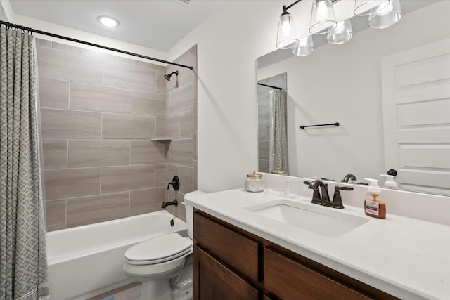 full bath featuring shower / tub combo with curtain, vanity, and toilet