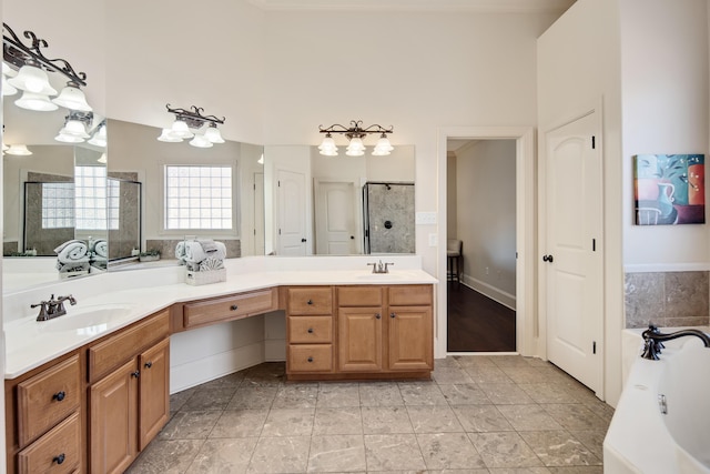 full bathroom with double vanity, a stall shower, a sink, and a bath