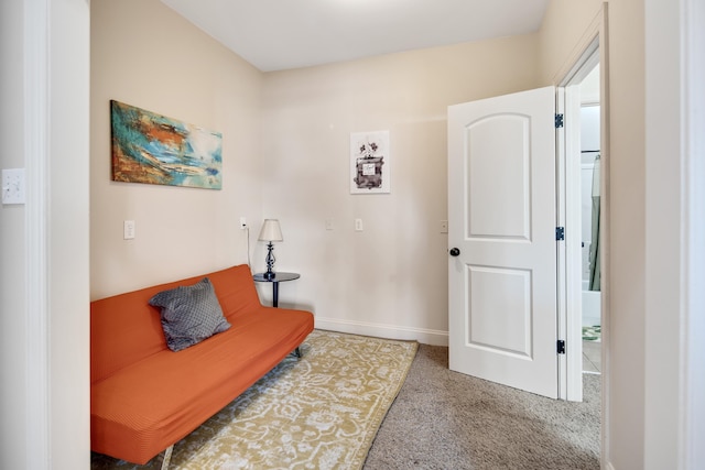 interior space featuring carpet and baseboards