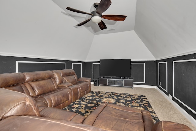 carpeted cinema room featuring ceiling fan, visible vents, and vaulted ceiling