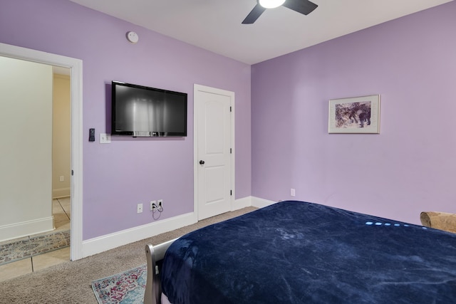 bedroom featuring carpet floors, baseboards, and a ceiling fan