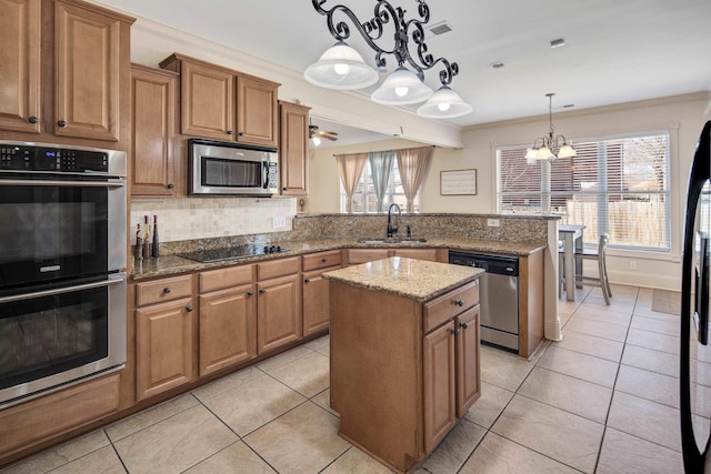 kitchen with light tile patterned floors, stainless steel appliances, visible vents, a sink, and a peninsula