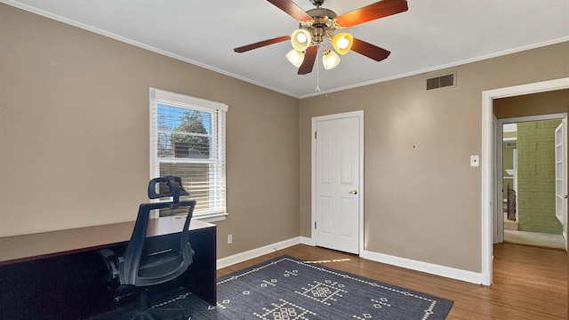 office area featuring ornamental molding, visible vents, baseboards, and wood finished floors