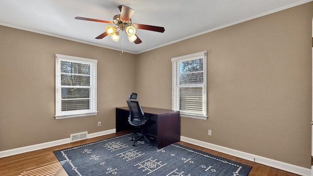 office area featuring visible vents, baseboards, and wood finished floors