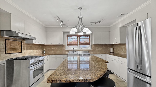 kitchen featuring under cabinet range hood, visible vents, white cabinets, appliances with stainless steel finishes, and crown molding