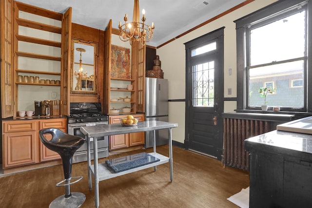 kitchen with dark wood-style floors, radiator heating unit, appliances with stainless steel finishes, open shelves, and a notable chandelier